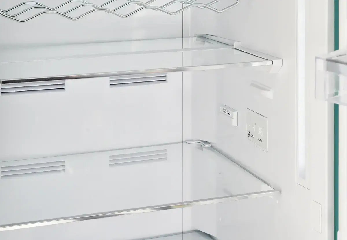 Interior view of Unique 12 Cu/Ft Classic Retro Refrigerator shelves, featuring chrome accents; available at Cabin Depot.