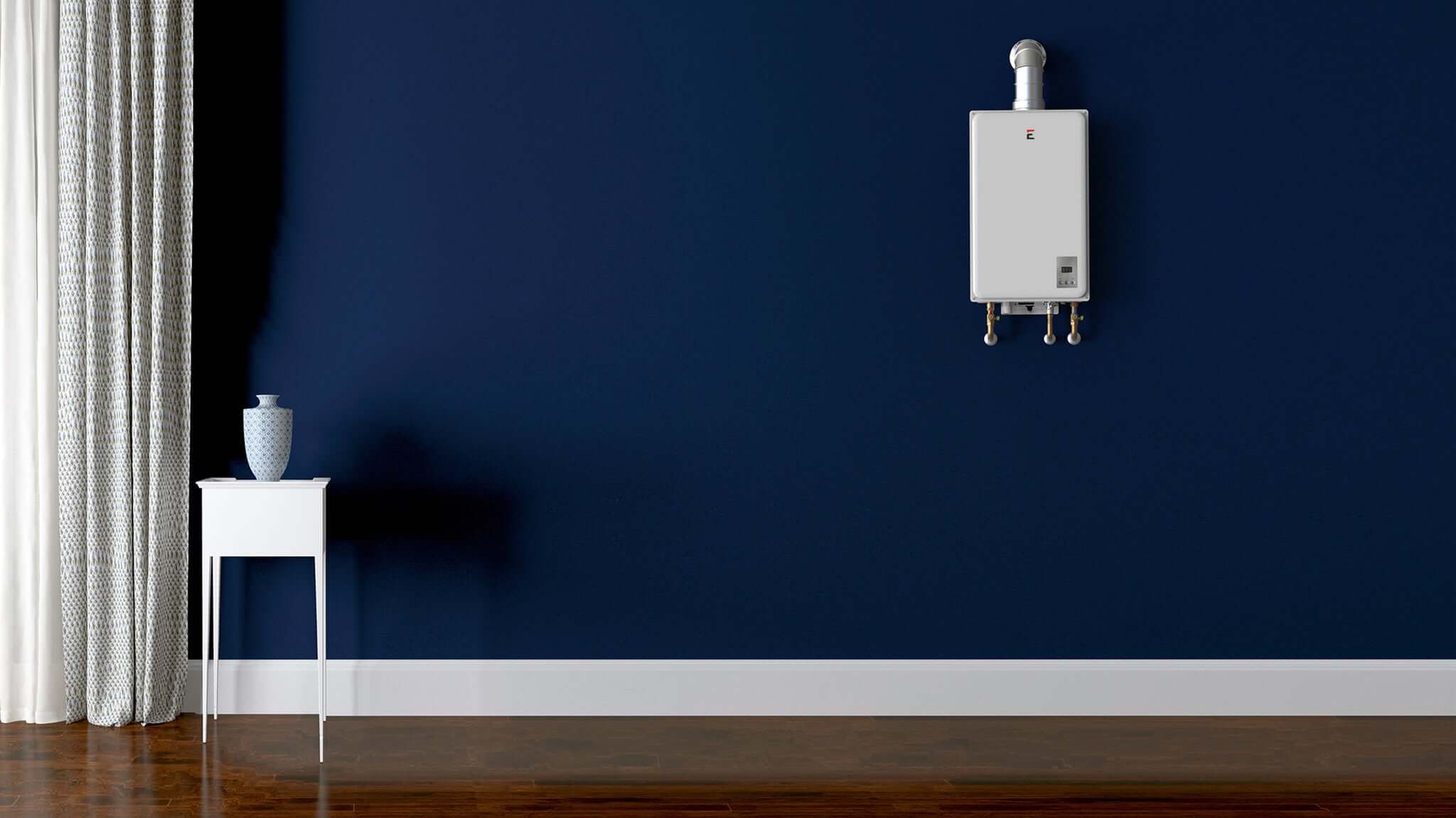 Eccotemp 6.8 GPM indoor tankless water heater on dark blue wall, ideal for home hot water solutions, available at Cabin Depot.