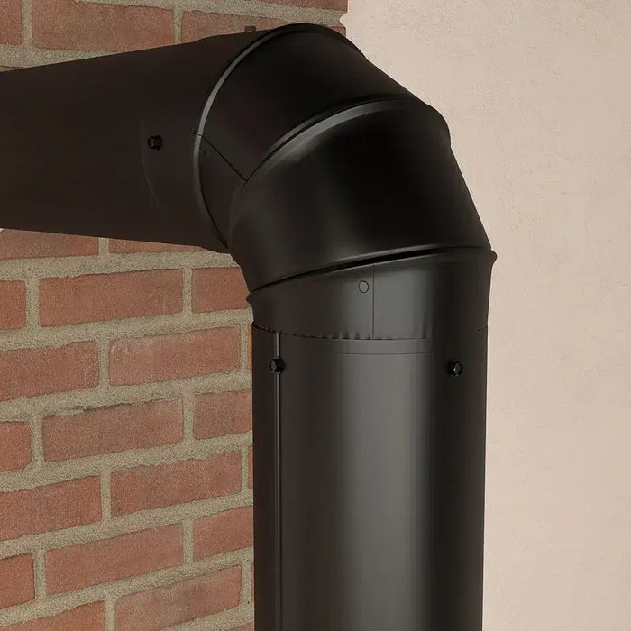 Black matte Imperial 6" 90-degree adjustable elbow connecting flue pipes on a brick wall.