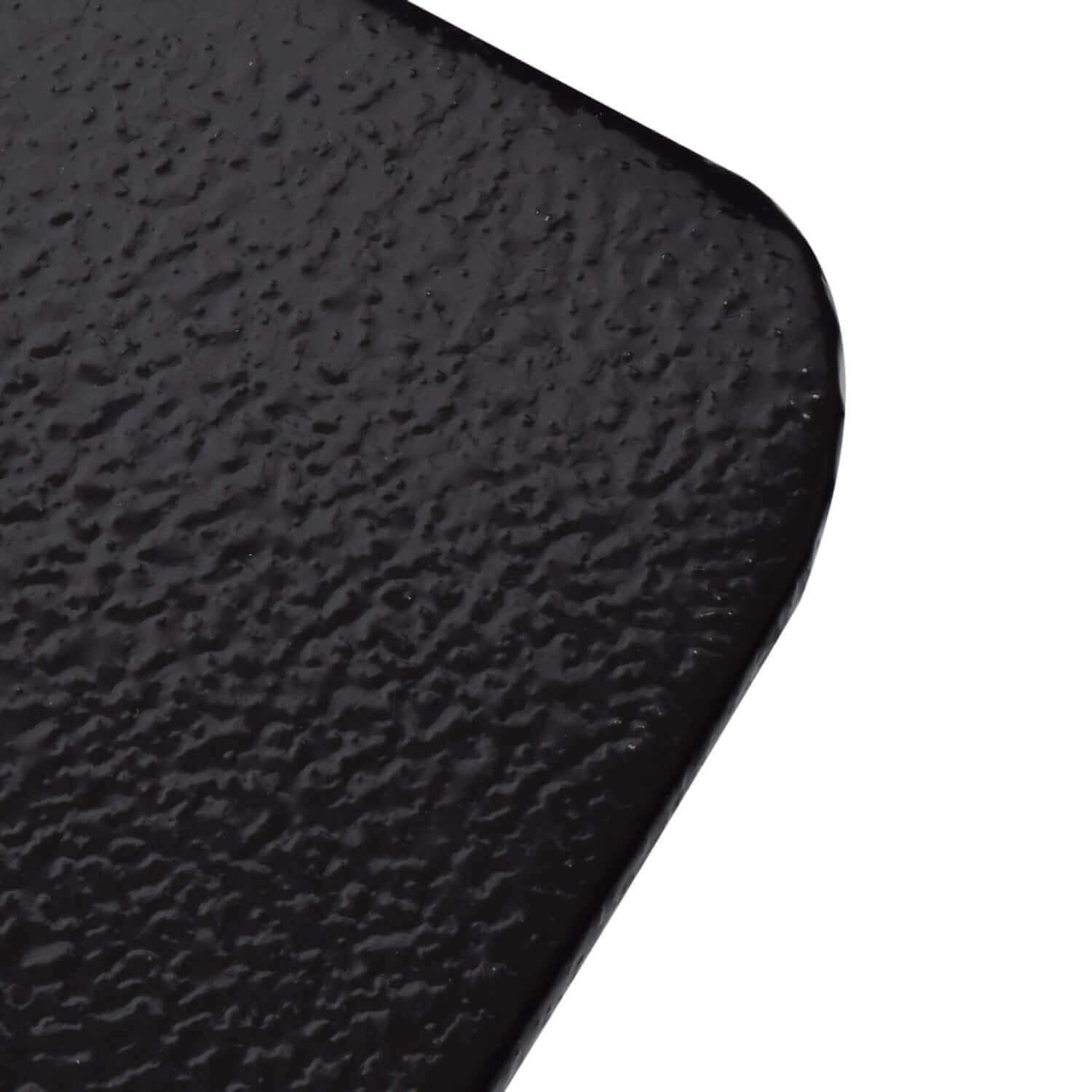 Close-up of the black pebble texture on Imperial 36" x 52" Stove Board from Cabin Depot, designed for ember protection with pellet stoves.