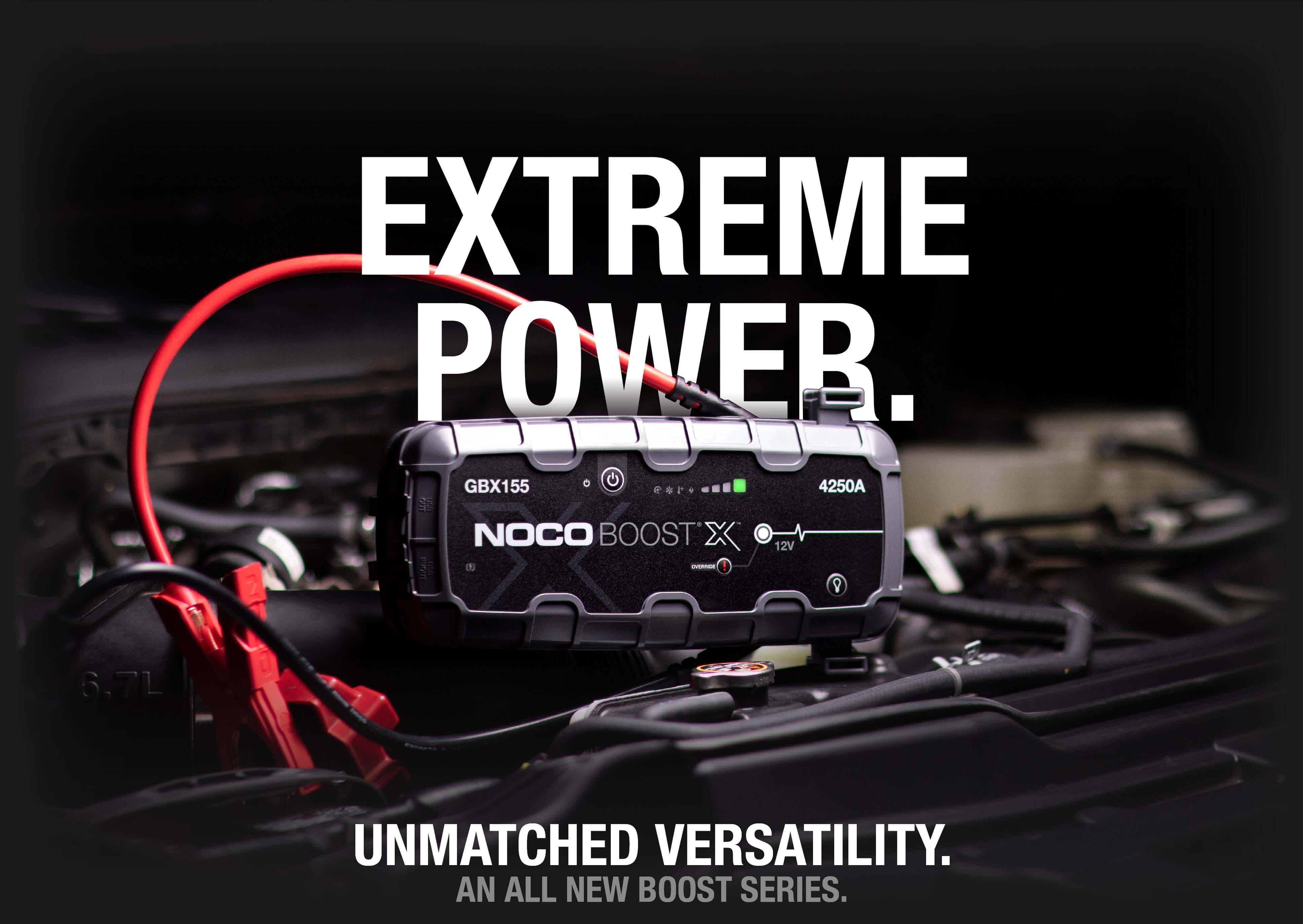NOCO 12V 4,250A Boost X Jump Starter on car engine showcasing extreme power, sold by Cabin Depot.