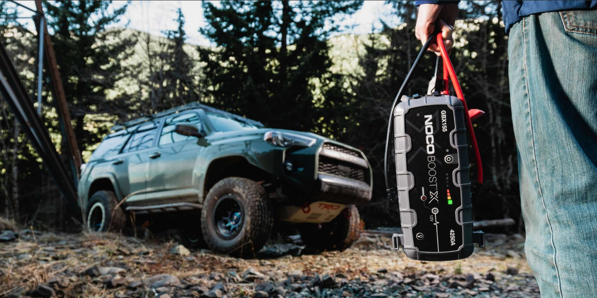 NOCO Boost X 4250A Jump Starter by Cabin Depot for 12V engines, suitable for cars and SUVs, shown outdoors for versatile use.