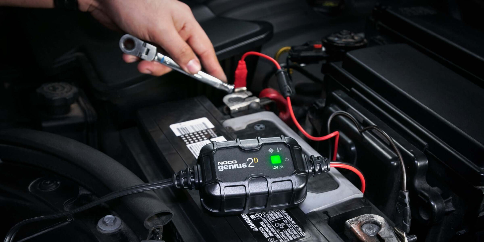NOCO GENIUS2D 2A Direct-Mount Battery Charger installed in a vehicle, available at Cabin Depot. Compact and energy-efficient design.