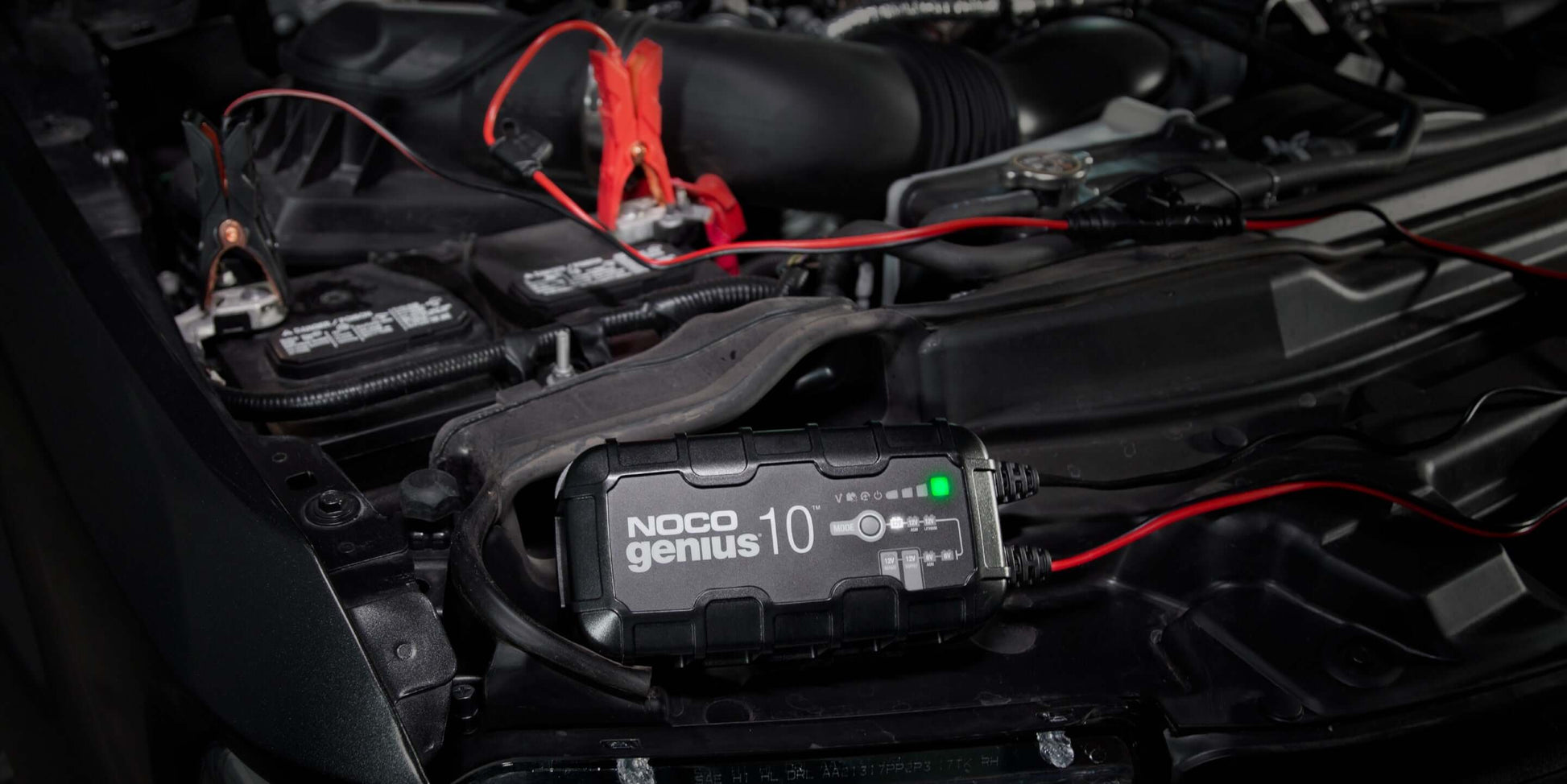 NOCO GENIUS10 10A Battery Charger in use for automotive batteries, available at Cabin Depot. Efficient 6V and 12V charging solution.