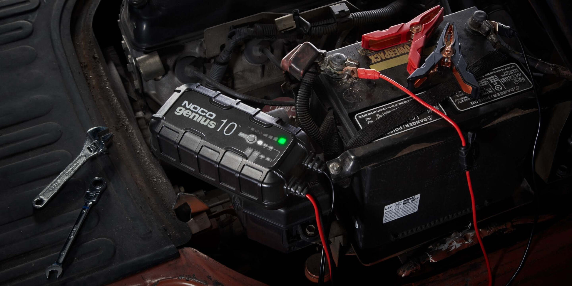 NOCO GENIUS10 10A Battery Charger in use on automotive battery from Cabin Depot