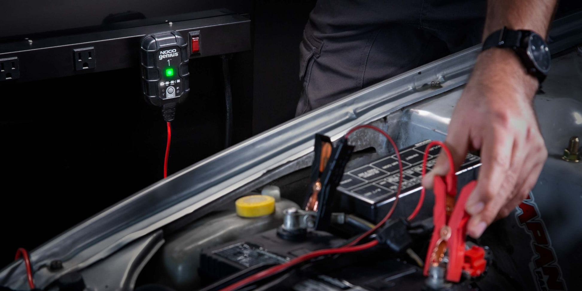 Using NOCO GENIUS1 1A Battery Charger for car battery maintenance at Cabin Depot, featuring energy-efficient desulfation.