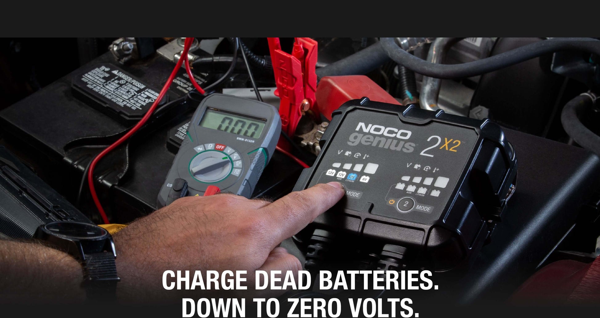 NOCO GENIUS2X2 4A Battery Charger in use, charging dead battery to zero volts, highlighting performance for Cabin Depot customers.