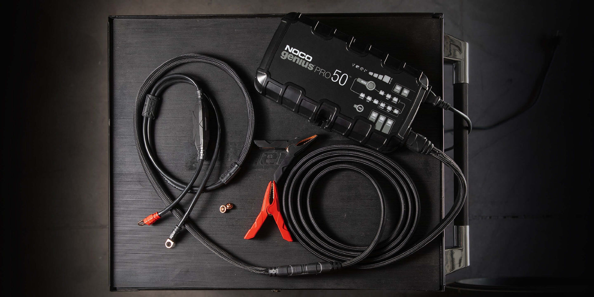 NOCO GENIUSPRO50 50A Battery Charger displayed with cables at Cabin Depot, suitable for automotive, marine, deep-cycle batteries.