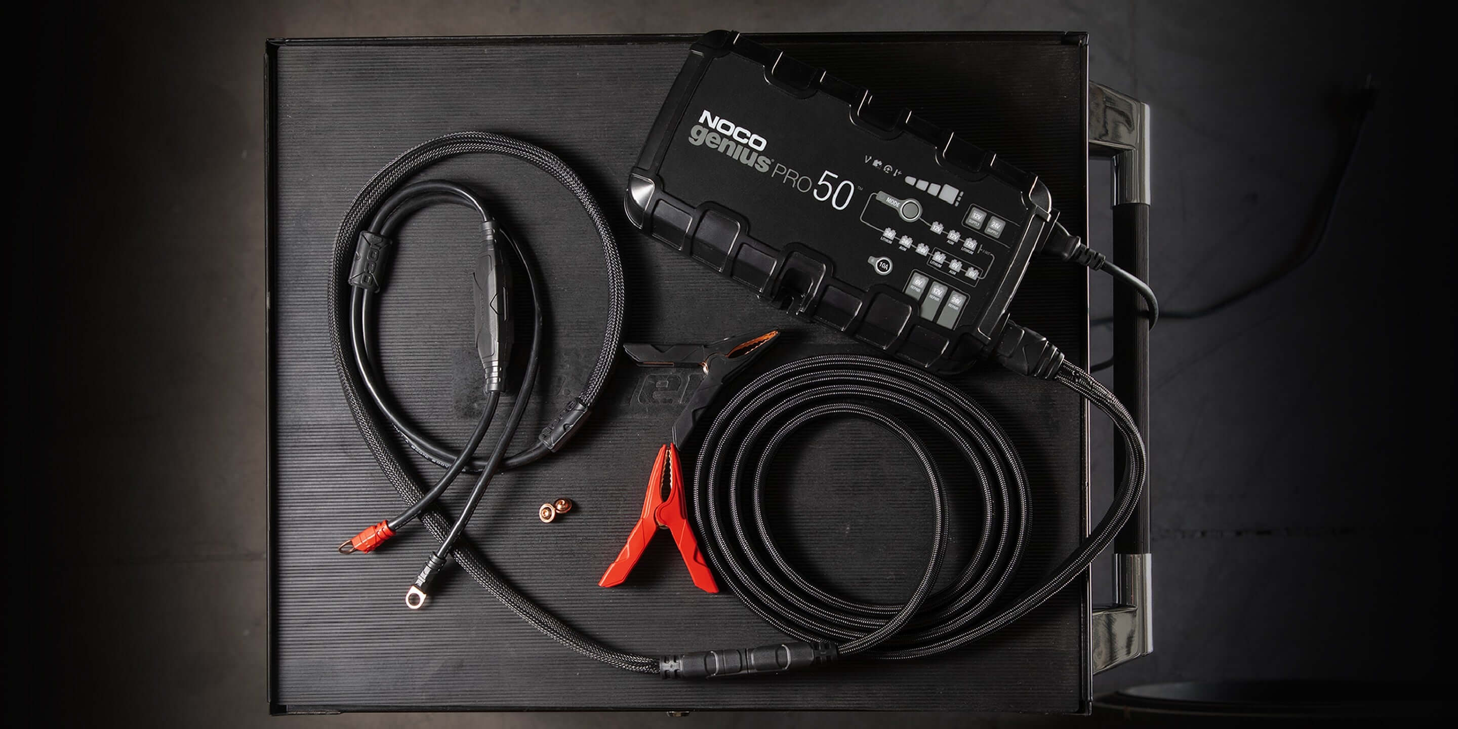NOCO GENIUSPRO50 50A Battery Charger displayed with cables at Cabin Depot, suitable for automotive, marine, deep-cycle batteries.