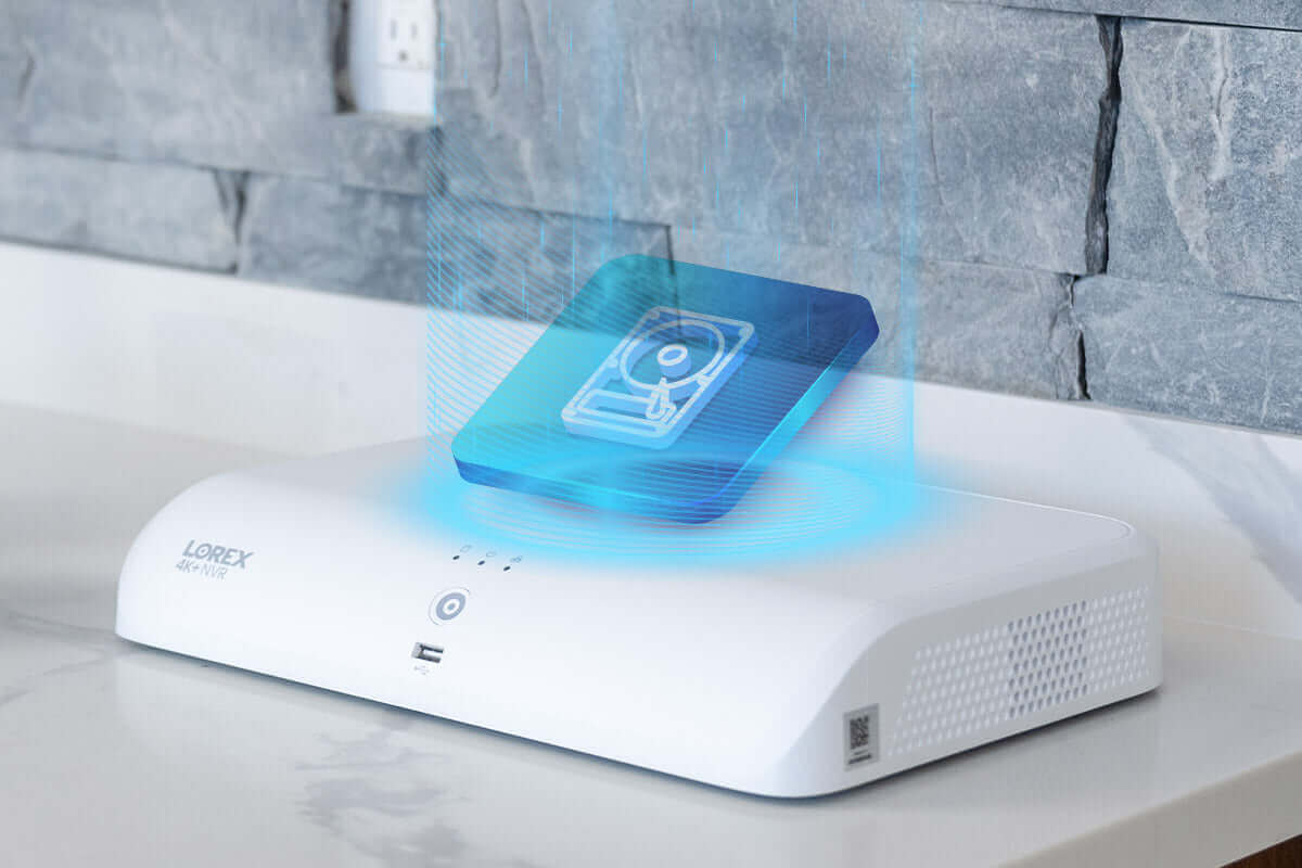 Lorex Fusion 4K+ NVR with digital interface, showcased on marble surface, enhancing smart security solutions from Cabin Depot.