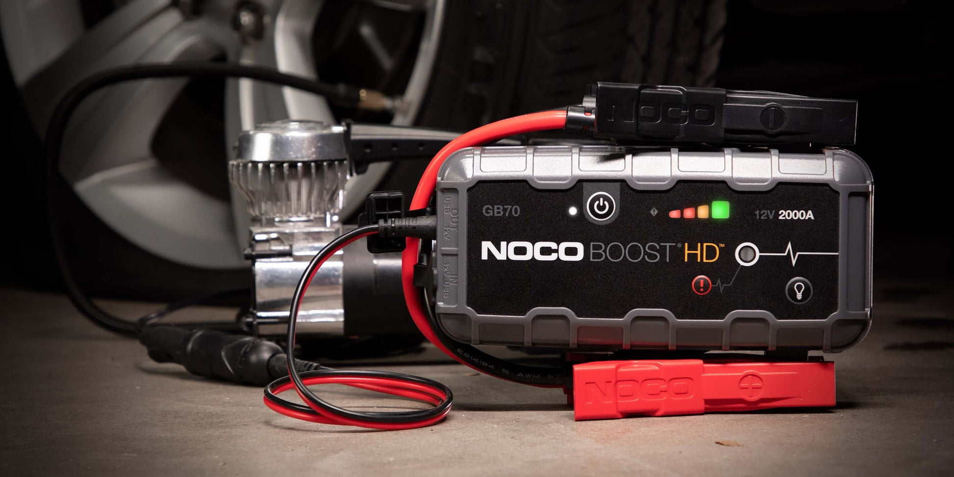 NOCO 12V 2,000A Boost Jump Starter GB70 shown with cables, ideal for safe battery jump starts and portable power at Cabin Depot.