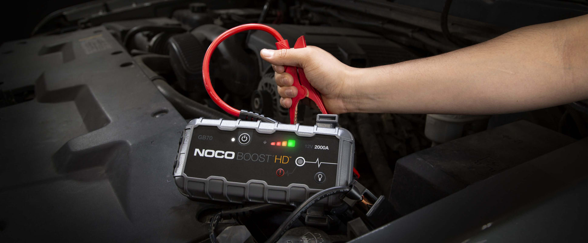 NOCO 12V 2,000A Boost Jump Starter in use, featuring UltraSafe lithium technology and spark-proof design at Cabin Depot.