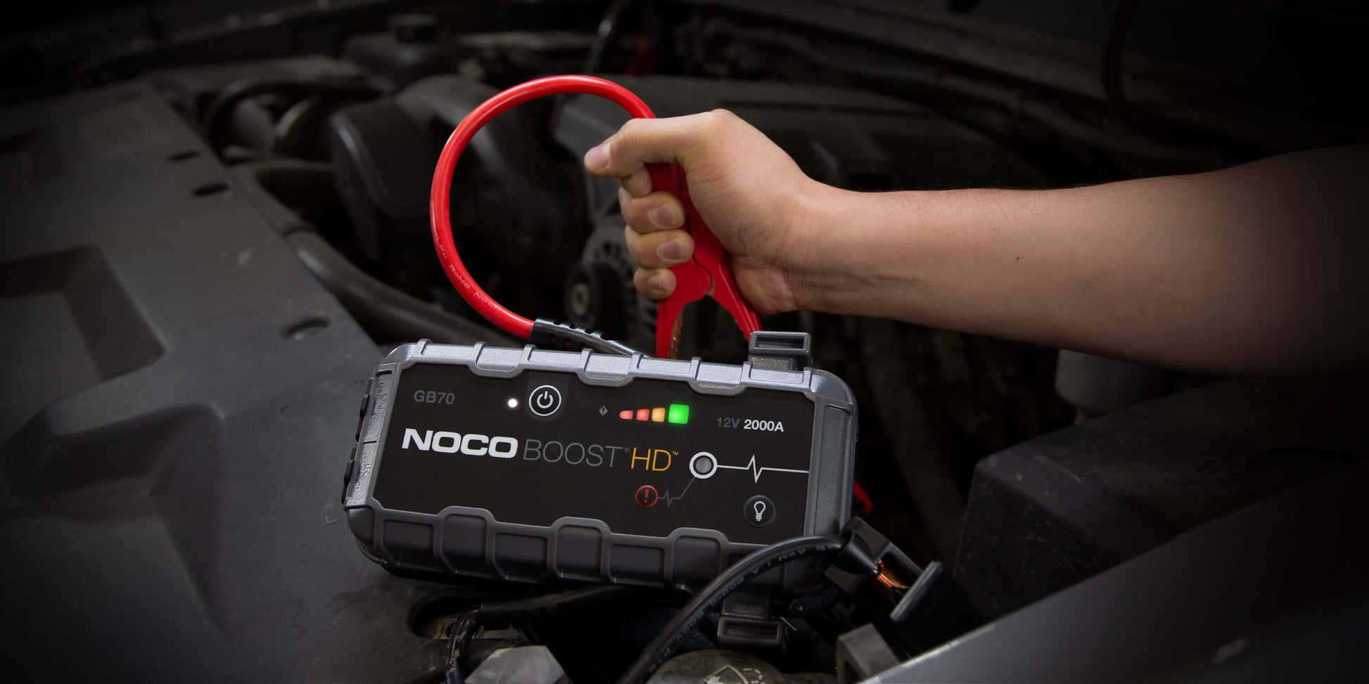 NOCO 12V 2,000A Boost Jump Starter in use for car battery, featuring UltraSafe technology, available at Cabin Depot.