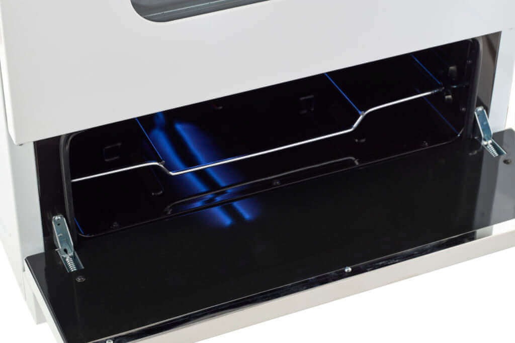 Open oven drawer of Unique 30" Classic Retro Propane Off-Grid Range, showing spacious interior with blue flame, available at Cabin Depot