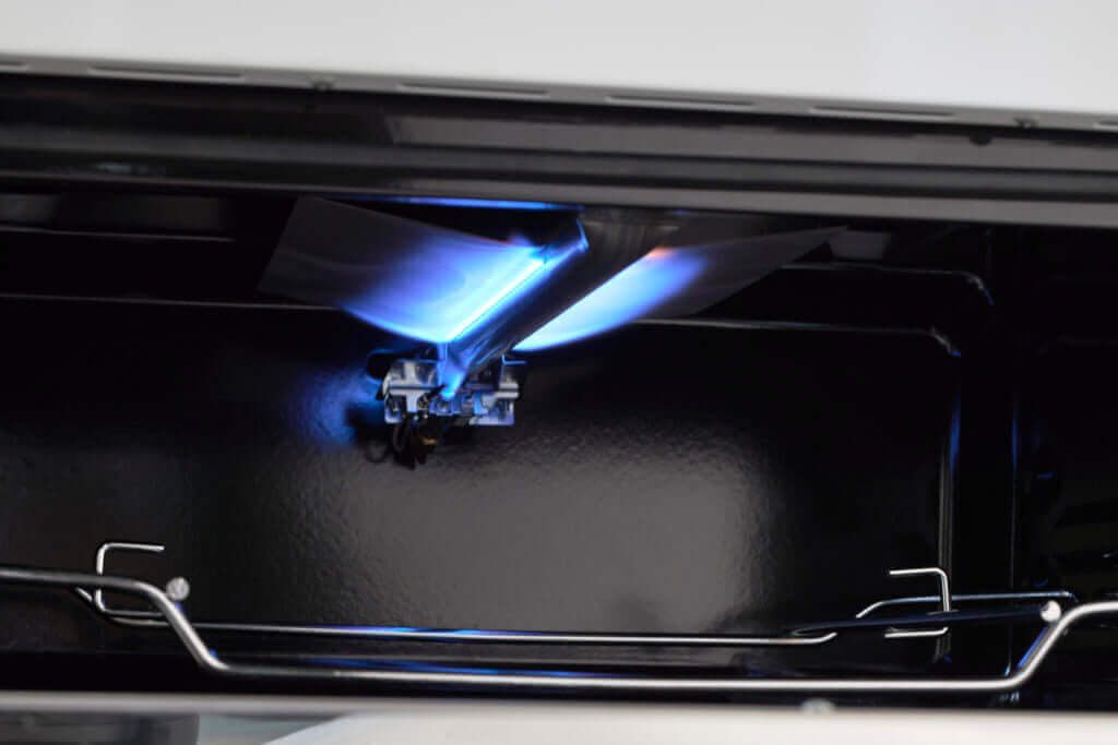 Close-up of ignition in Unique 30" Classic Retro Propane Off-Grid Range, available at Cabin Depot.