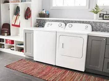 Modern laundry room with Amana 4.4 Cu. Ft. white top-load washer featuring a Dual Action Agitator and stainless steel tub at Cabin Depot.