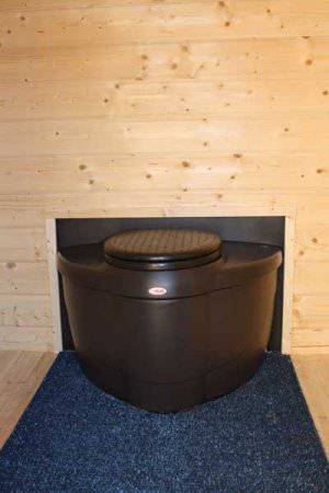 Biolan Populett Composting Toilet in cabin setting, ideal for high-use areas, available at Cabin Depot, eco-friendly waste solution.