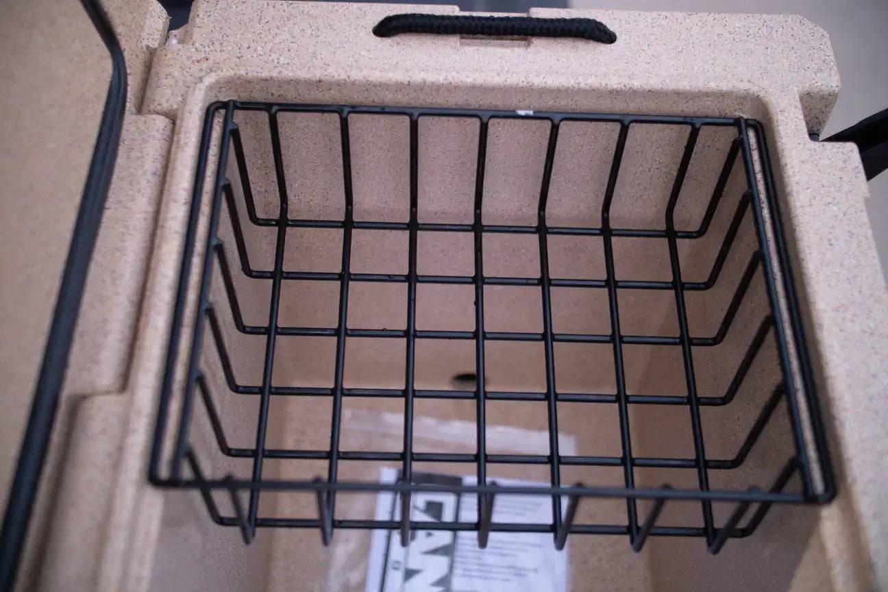Canyon Coolers 55QT Outfitter Basket with thick rubber dipped frame inside cooler, keeping perishables organized at Cabin Depot.