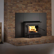 Century CW2900 wood stove with faceplate in brick hearth, featuring a large firebox and Cabin Depot quality.