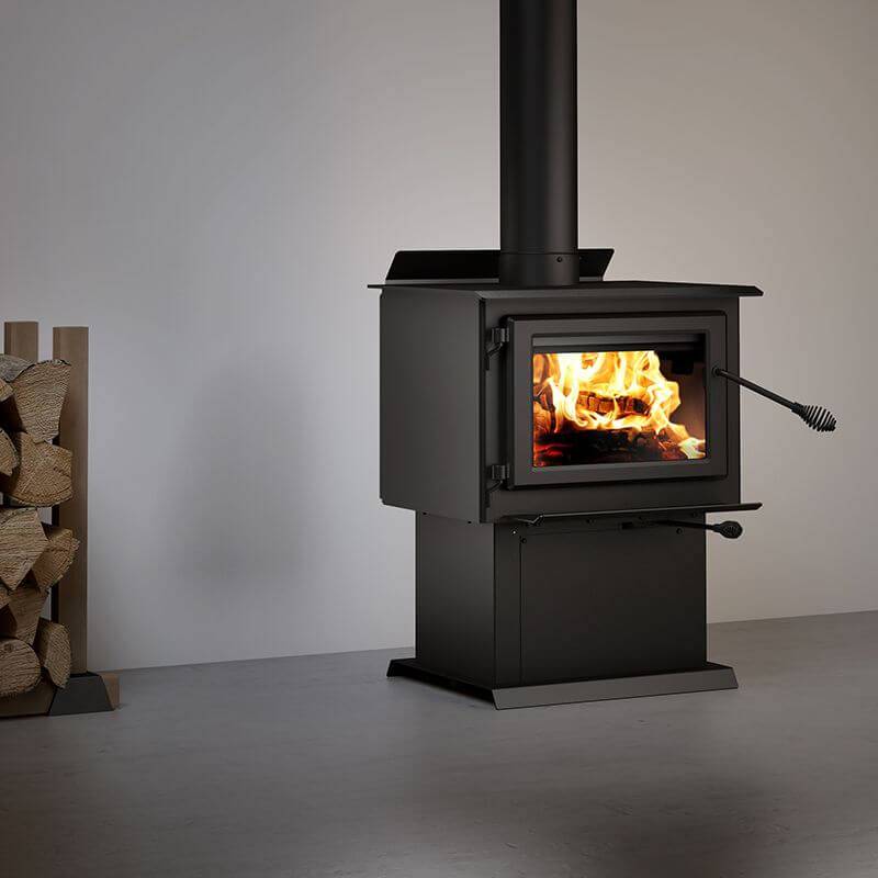 Century FW2800 Wood Stove from Cabin Depot with stainless steel heat protector, ideal for tight spaces, mobile home and alcove installation.