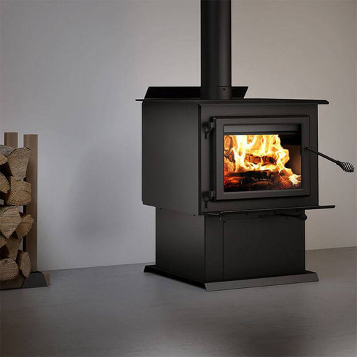 Century FW3500 Wood Stove on pedestal with fire burning, high-efficiency and EPA certified, suitable for large spaces.