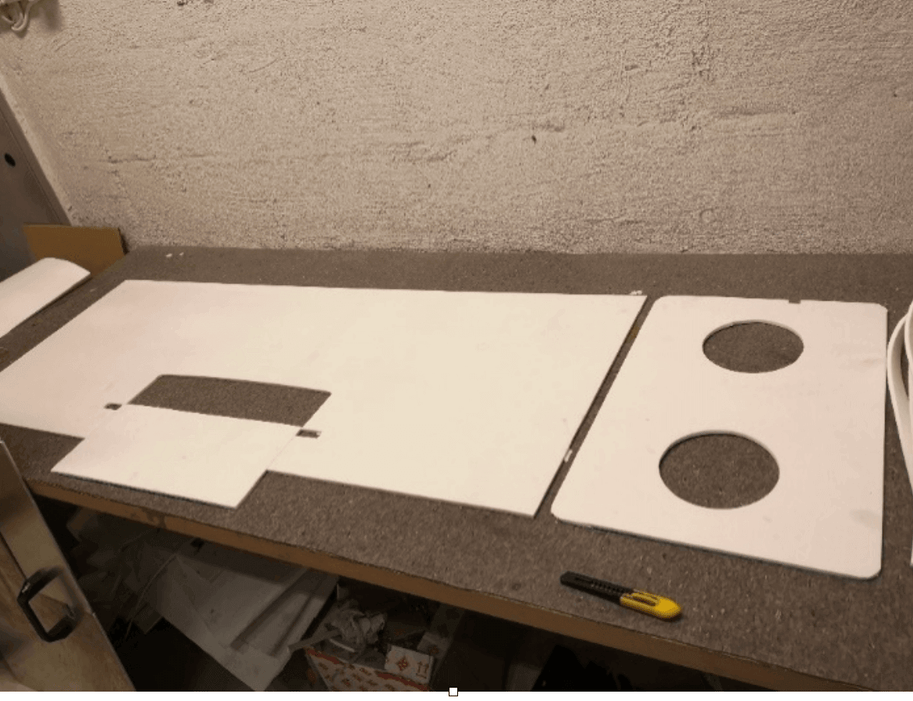 Components of the Cinderella Comfort Arctic Insulation Kit for incineration toilets on a workbench.