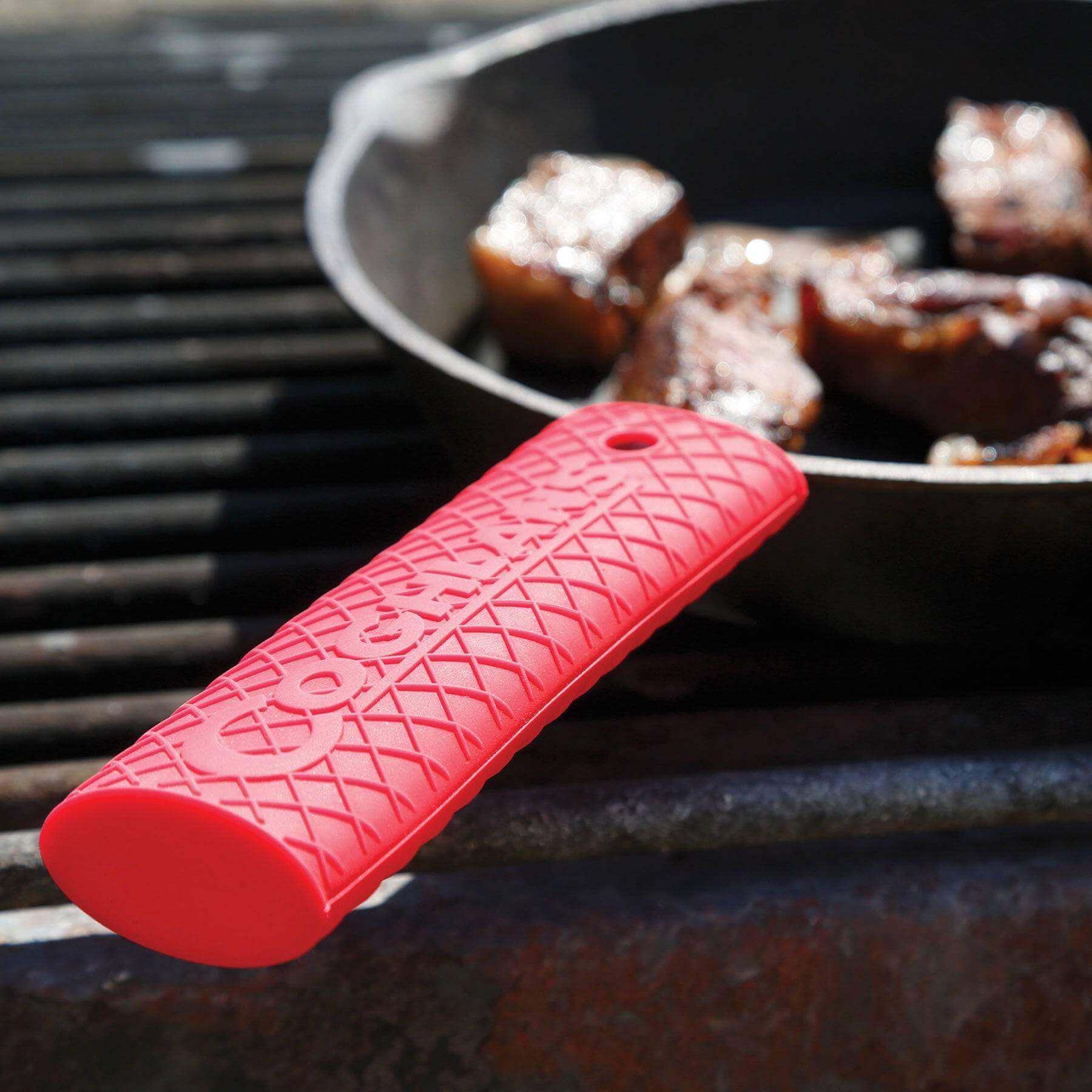 Coghlans Silicone Handle Grip fits a pot handle, non-slip, heat-resistant, ideal for camping, home kitchens; available at Cabin Depot.
