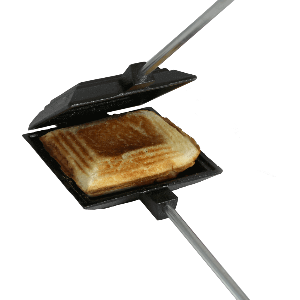 Cast iron camp cooker with sandwich, Coghlans product from Cabin Depot, perfect for open fire cooking, easy to clean and transport.