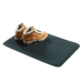 Outdoor mat with hiking boots, showcasing the durable Coghlans Inside/Outside Mat with non-skid backing and mold-resistant material.