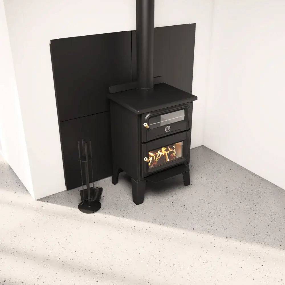 Wood stove with SBI Modular Heat Shield System from Cabin Depot, featuring black panels for reduced wall clearances and enhanced safety.