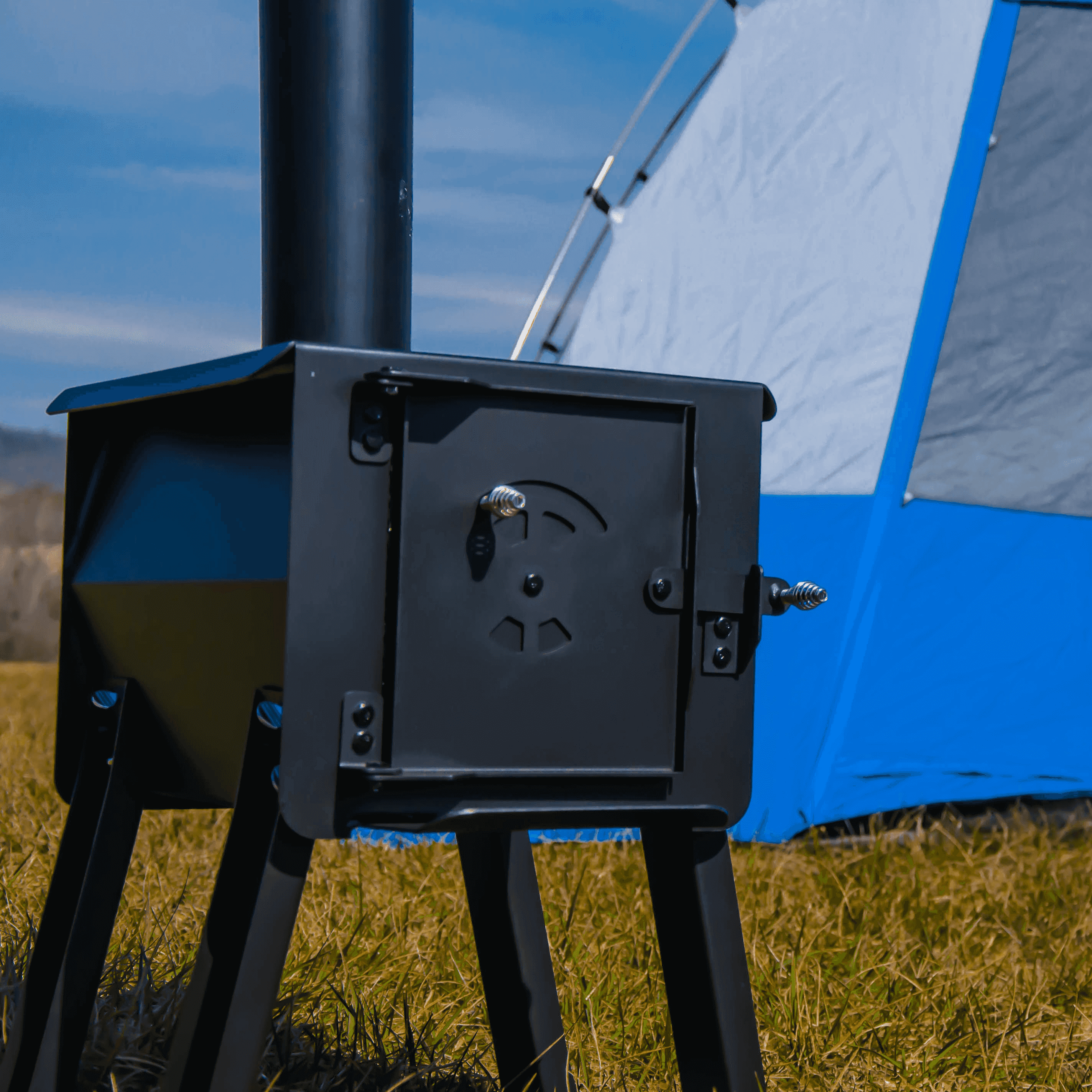Englander Black Bear Camp Stove by Cabin Depot, ideal for portable use in a wall tent, featuring heavy-duty steel construction.