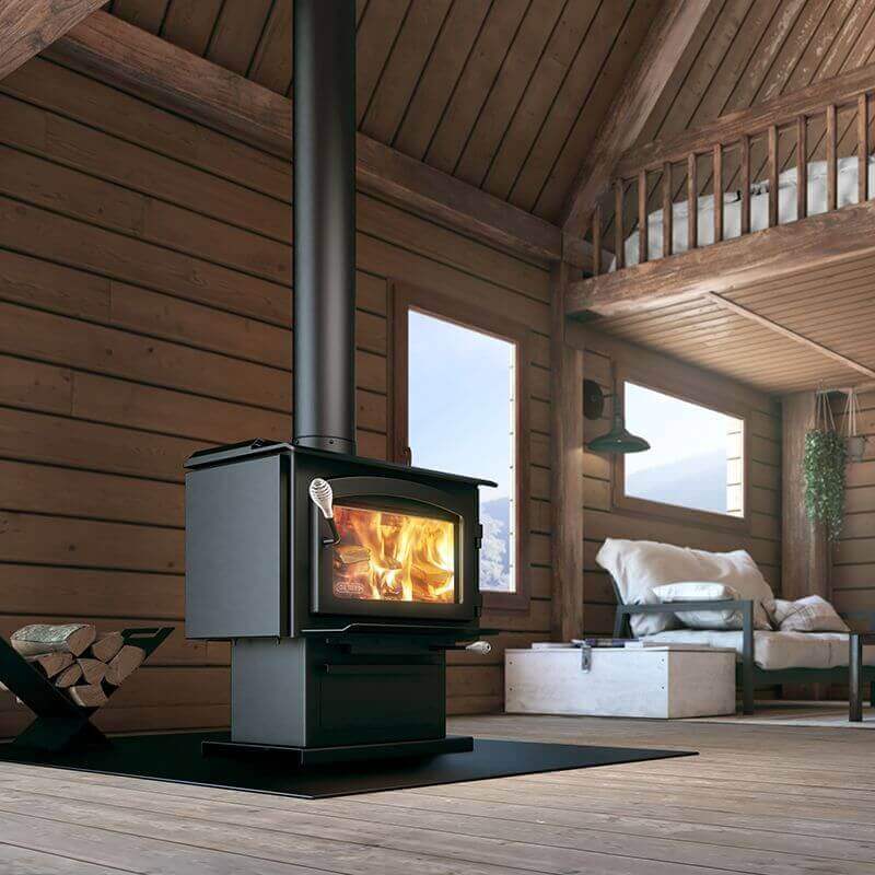 Drolet Escape 1500 Wood Stove in cabin setting, ideal for heating homes up to 1,800 ft², available at Cabin Depot with free shipping.