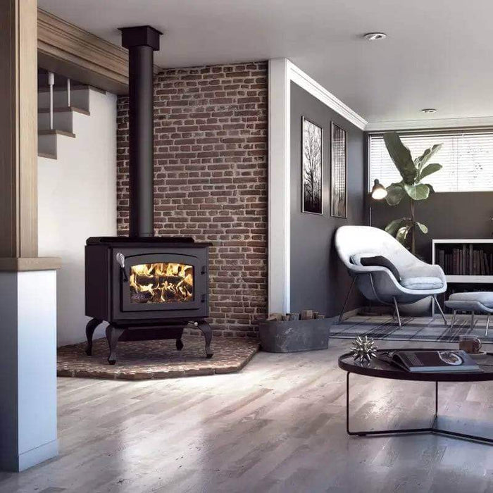 Modern living room with Drolet Escape 1800 wood stove on legs, black chimney, and stylish furniture for a cozy ambiance.