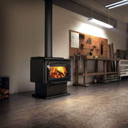 Drolet Escape 2100 wood stove in workshop, powerful heater for 2700 sq ft, 110,000 BTU/h, low emissions from Cabin Depot.