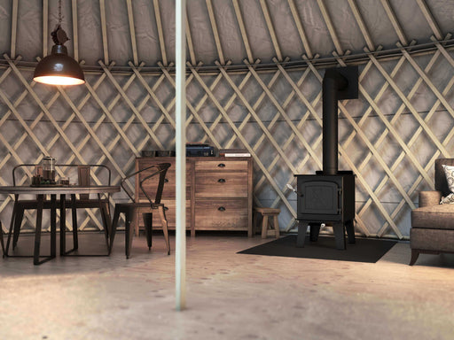 Drolet Fox Wood Stove in cozy room, surrounded by rustic furniture.