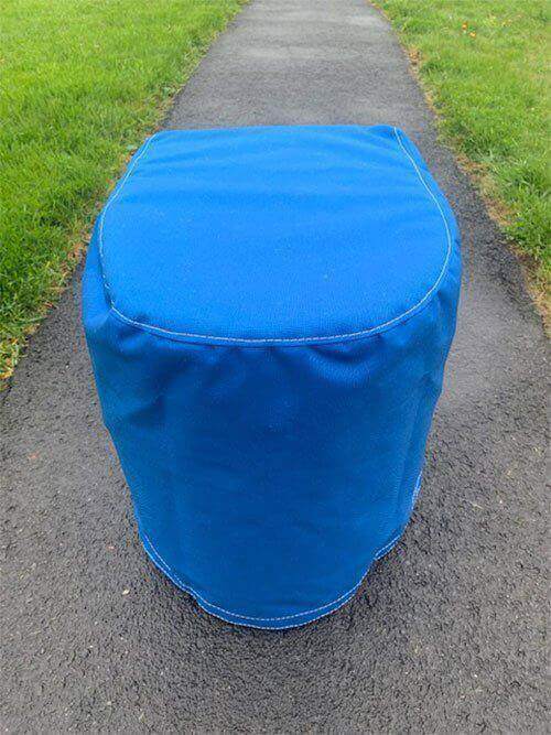 Royal Blue canvas Laveo Dry Flush Seat Cover, durable and versatile, ideal for boaters, shown outdoors on pavement.