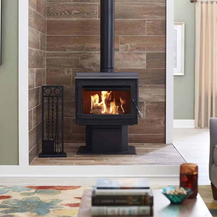 Englander 15-W06 wood stove with blower in a modern living room setting, featuring a lit fire in the 3.2 cu. ft. firebox.