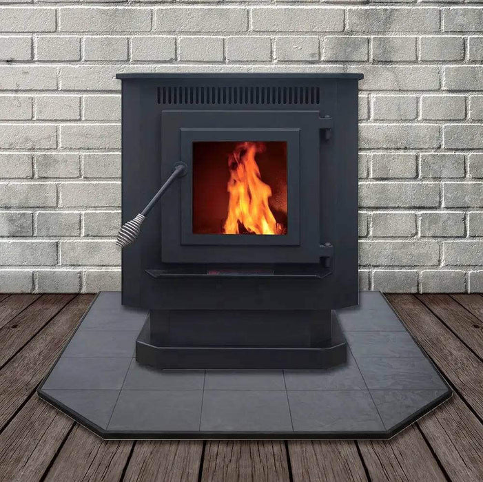 Englander 25-PDVC Pellet Stove with flame, set against brick wall and wooden floor, showcasing efficiency and compact design.