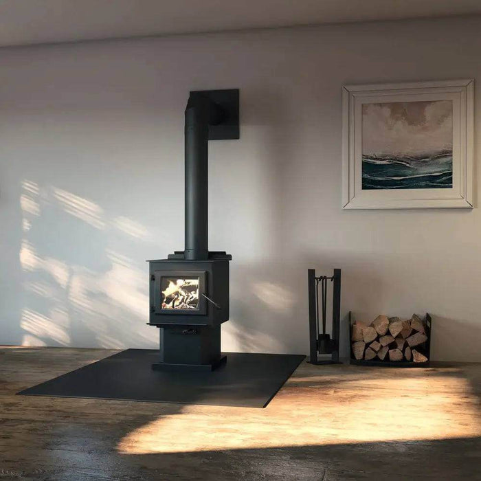 Englander Blue Ridge 100 Wood Stove in a cozy room setting, showcasing its modern design and ceramic glass door, ideal for tight spaces.