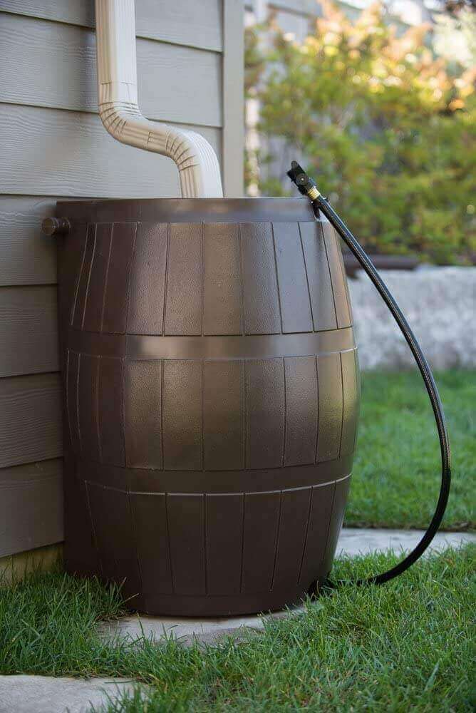 FCMP Outdoor 50Gal Rain Catcher Barrel by Cabin Depot in garden setting.