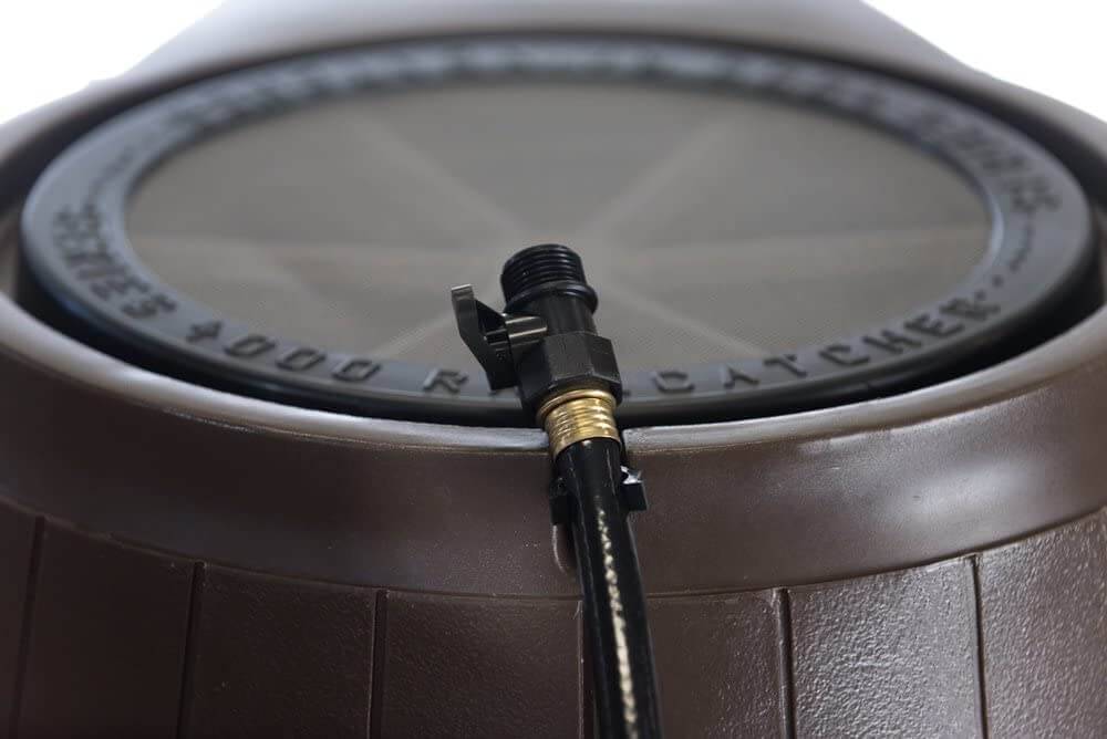 Close-up of FCMP Outdoor 50Gal Rain Catcher barrel lid and spout, available at Cabin Depot, showcasing durable rainwater collection features.