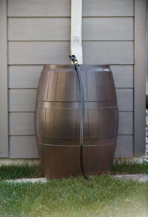 FCMP Outdoor 50Gal Rain Catcher Barrel installed, showcasing traditional barrel design for efficient rainwater collection.