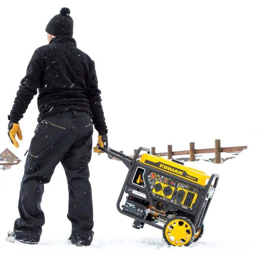 Person transporting Firman 4200W Whisper Series generator with CO Alert in snowy landscape, available at Cabin Depot.