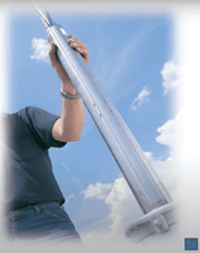 Person holding Grundfos 3" 115V Submersible Pump under blue sky, promoted by Cabin Depot
