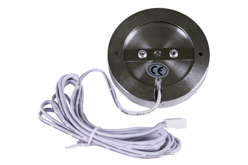 Kedron 12V circular flush cabinet light with silver finish, shown with white wiring for easy connection to Kedron 12V Splitter Hub and AC Adapter.