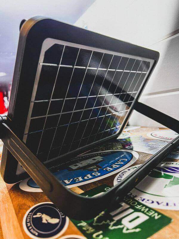 Kedron 10W multifunction LED solar light with built-in panel by Cabin Depot, featuring adjustable mounting bracket for versatile installation.