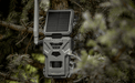 Spypoint Flex-S Cellular Trail Camera mounted on a tree for wildlife monitoring with real-time updates.