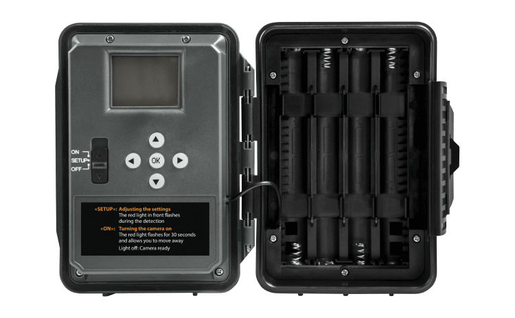 Spypoint FORCE-48 Trail Camera open view showcasing configuration screen and battery compartment.