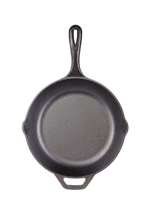 Lodge 10-inch Chef Collection Skillet with ergonomic handle, seasoned with natural oil, available at Cabin Depot.
