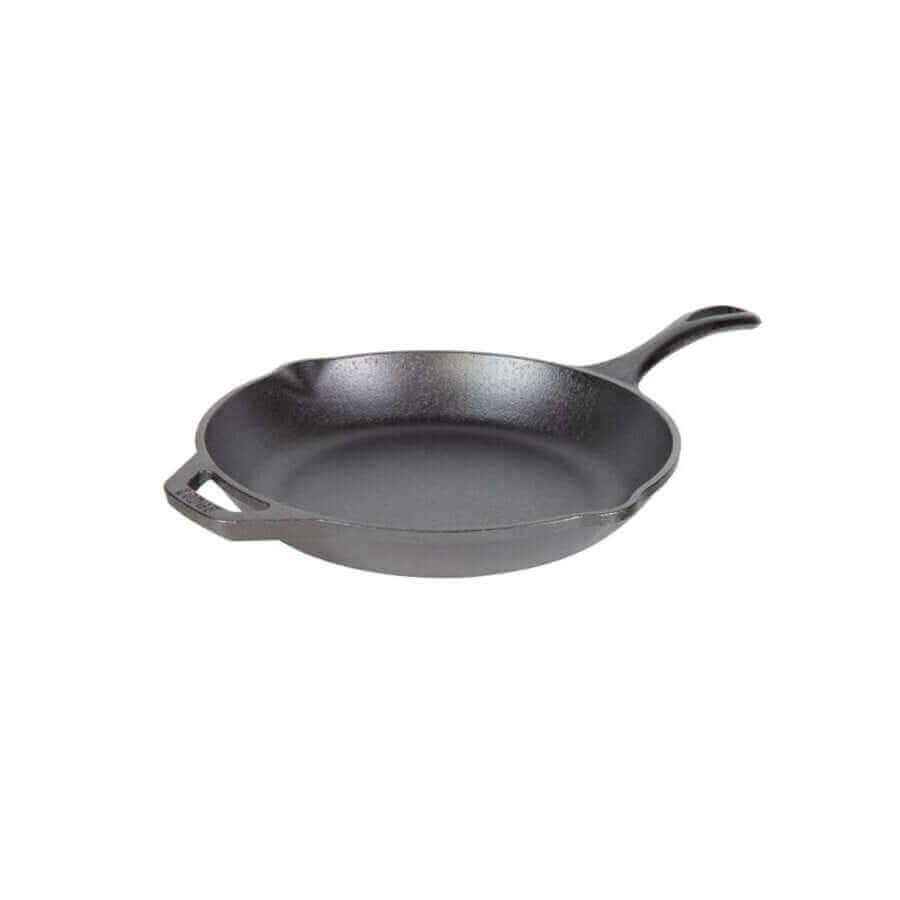Lodge 10-inch Chef Skillet with ergonomic handle from Cabin Depot, featuring spatula-friendly sidewalls and pour spouts for versatile cooking.